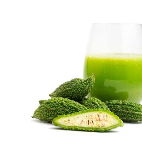 Herbal juice with bitter melon or bitter gourd on white background. free space for text