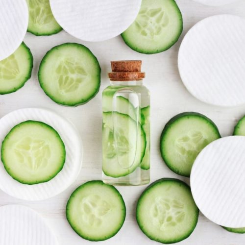 green cucumber slices, cotton-pads, top view ingredients.